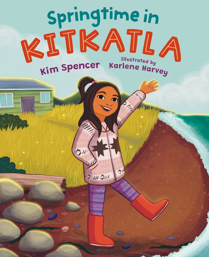 Springtime in Kitkatla by Kim Spencer. Illustrated by Karlene Harvey. A young person with a ponytail in a woollen coat, tights and red rubber boots stands on a rocky shore waving.