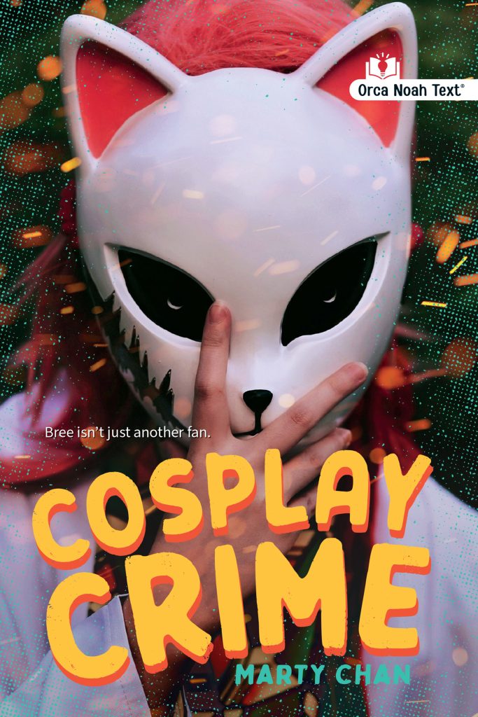 Cosplay Crime by Marty Chan. Logo: Orca Noah Text. The head and shoulders of a figure with pink hair who holds a white full mask with cat-like features and pink ears over their face.