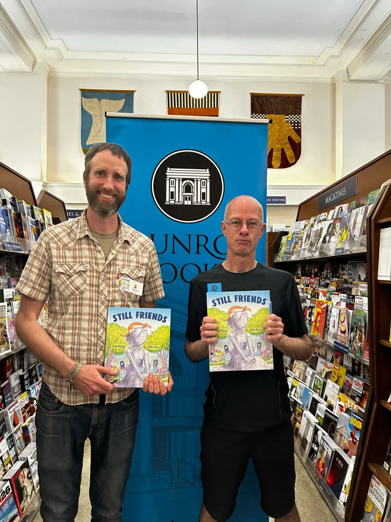 Troy Wilson and Mike Deas with their book Still Friends